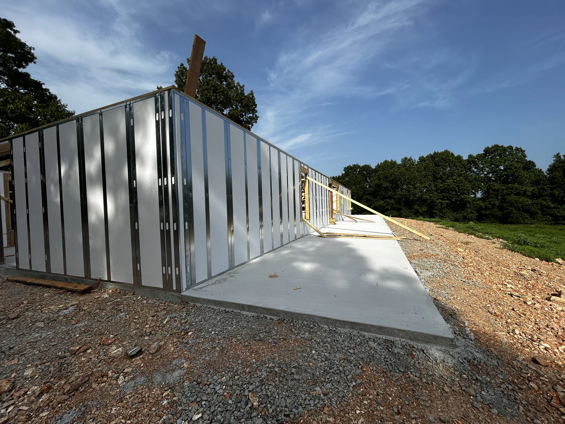 ThermaTech IHP Wood and Metal panels installed on a concrete slab